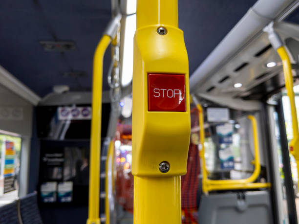 istock focus on a red 'Stop' button inside a metro bus in Seattle, WA 1310983013