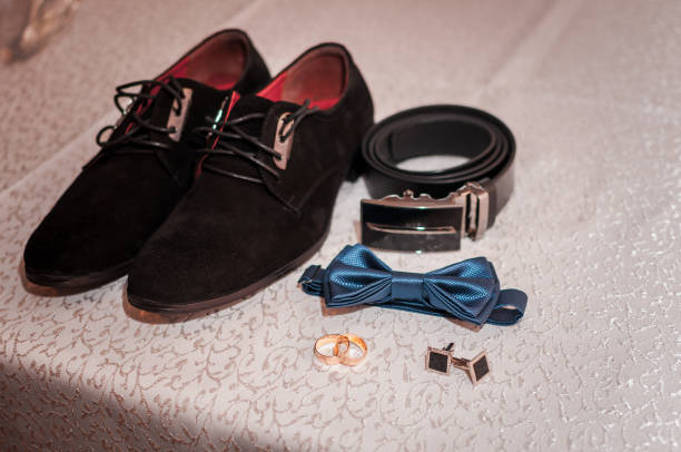 istock Grooms accessories and wedding rings on the table 1310985986