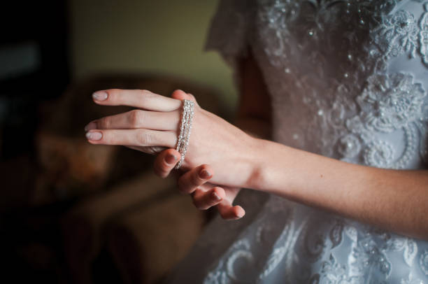istock Bride wearing bracelet on the hand 1310986278