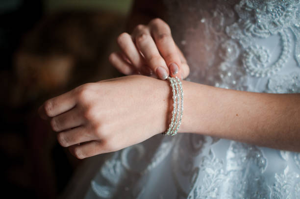 istock Bride wearing bracelet on the hand 1310986280