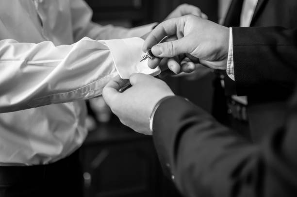 istock A groom fastening a cuff-link before getting married 1310987137
