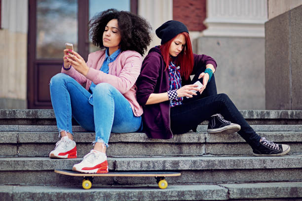 istock Girlfriends in conflict are texting and sulking each other 1310987176