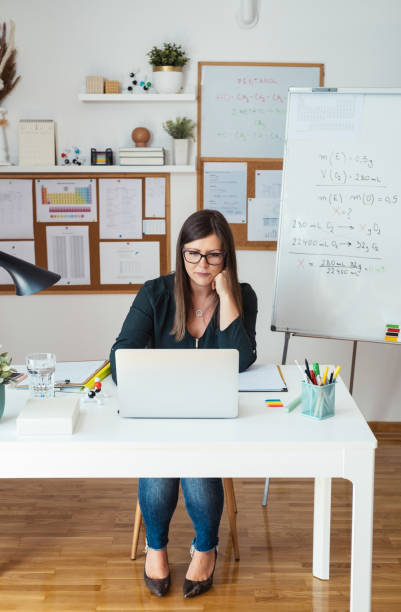 istock Experienced teacher or professor holding online class to e-learning students during pandemic period 1310987265