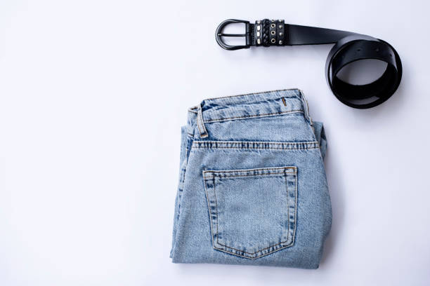 istock Jeans and belt isolated on white background. 1310989110