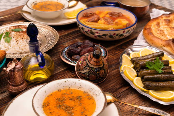 Traditional Turkish dinner include pilaf (boiled rice), lentil soup, Izmir meat balls with potatoes, sarma, kibbeh (aka icli kofte), dried date fruits. Ramadan iftar (evening meal after fasting). Ramadan iftar (evening meal after fasting). iftar photos stock pictures, royalty-free photos & images