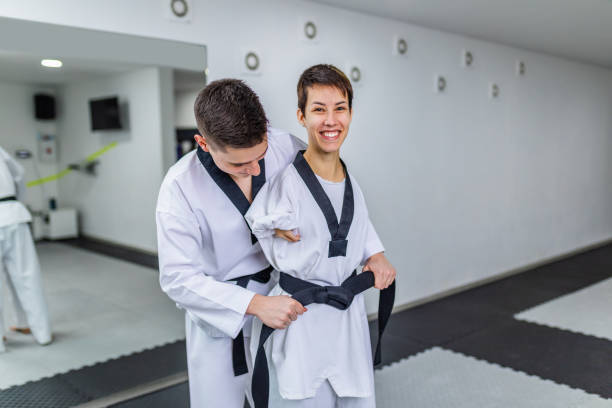 istock Disabled woman training taekwondo with her coach. 1310997592