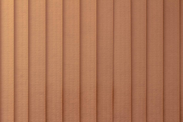 istock Abstract design background of vertical window blinds in a gradient salmon color 1310997704