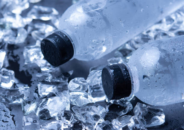 istock Water bottle is cooling on the ice cube,wood background 1310999490