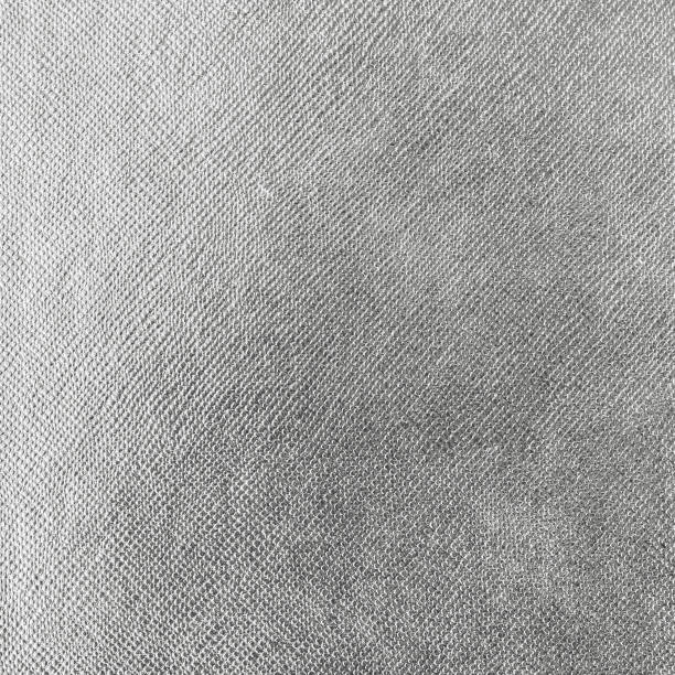 istock Silver background wrapping foil paper shiny white grey metallic leather texture backdrop for wall paper decoration element 1311001375
