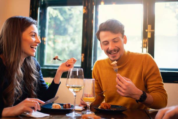 istock Happy couple having a lunch in a restaurant 1311001973