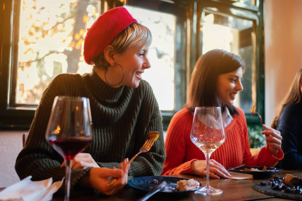 istock Happy women having a lunch in a restaurant 1311001974