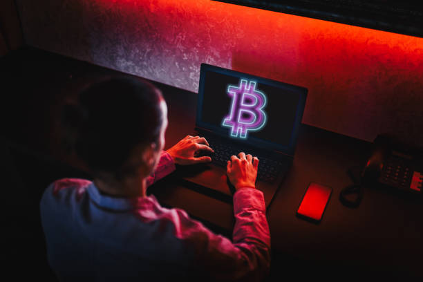 istock Unrecognizable person using his laptop to trade Bitcoin. Bitcoin / Cryptocurrency concept. 1311002189