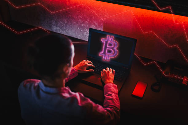 istock Unrecognizable person using his laptop to trade Bitcoin. Bitcoin / Cryptocurrency concept. 1311002190