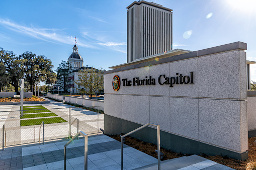 Tallahassee, United States - March 11, 2021:  The Florida State Capitol Building and complex, the grounds of which currently fenced off undergoing construction.