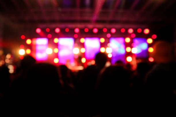 istock Blur background of concert lighting on stage 1311008724