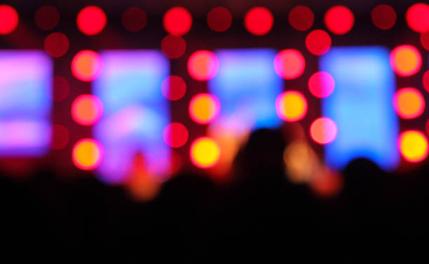 istock Blur background of concert lighting on stage 1311008736