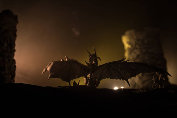 istock Battle between dragon and heroic soldiers. Creative table decoration. Selective focus 1311008806