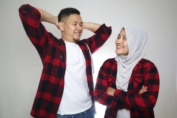 Happy Asian muslim couple looking each other with smile. Love romance Happy Asian muslim couple looking each other with smile. Love romance concept malay couple stock pictures, royalty-free photos & images