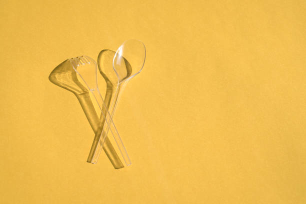 Yellow egg spoon isolated on white eith clippimg path