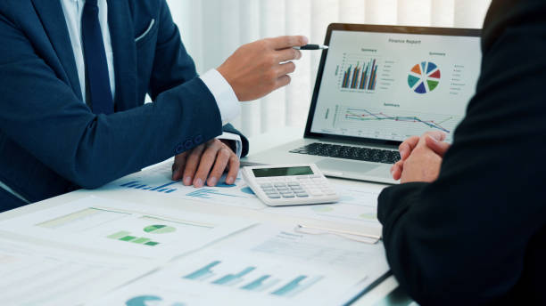istock Group of business people analysis summary graph reports of business operating expenses and work data about the company's financial statements. 1311015736