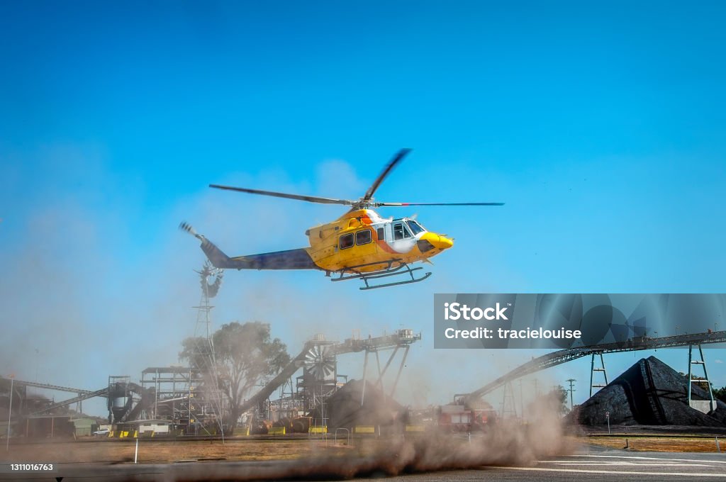 Helicopter Landing Helicopter landing at an open cut coal mine Helicopter Stock Photo