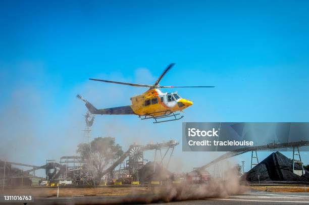 Helicopter Landing Stock Photo - Download Image Now - Helicopter, Mining - Natural Resources, Landing - Touching Down