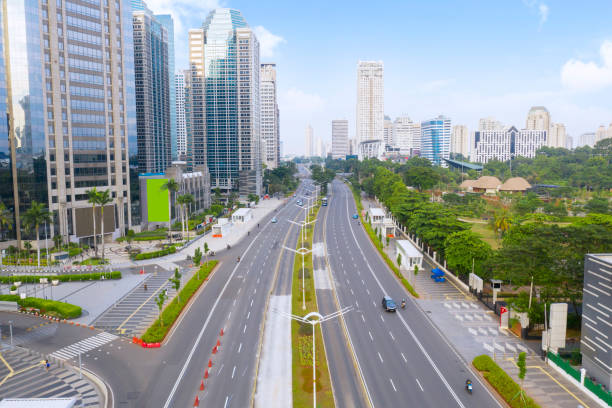 Empty traffic on Sudirman street with skyscrapers