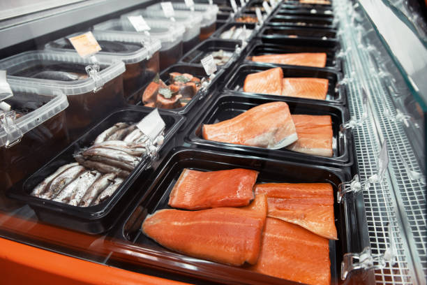 istock Fish and seafood stall in a market 1311025712