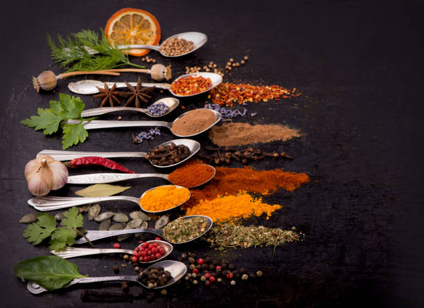 istock Spices and condiments for cooking on a black background 1311026701