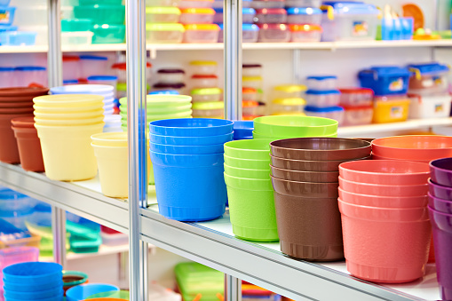 Colored plastic plant pots in store