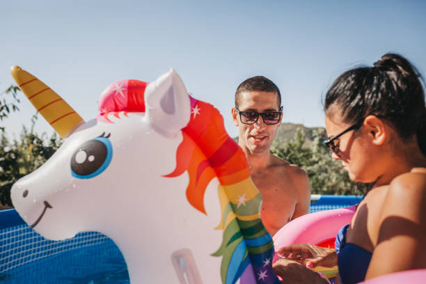istock Young couple are relaxing in swimming pool 1311030352