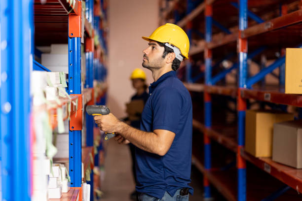 istock Group of male and female warehouse worker using barcode machine checking products or parcel goods on shelf pallet in industry factory warehouse. Inspection quality control 1311033049