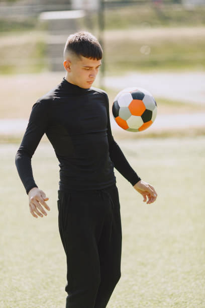 istock Sporman is playing football and practising with the ball 1311033217