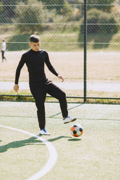 istock Sporman is playing football and practising with the ball 1311033245