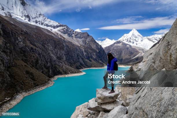Tourist Woman Staring At The Amazing Lake Paron In Cordillera Blanca Of Peru Stock Photo - Download Image Now
