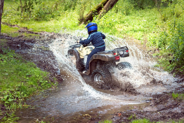 istock A trip on the ATV on the red road. 1311036198
