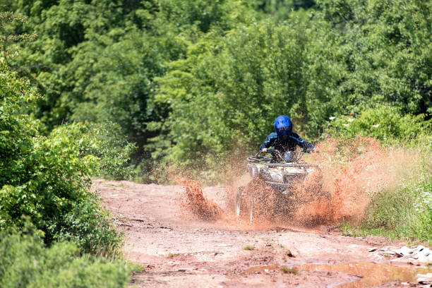 istock A trip on the ATV on the red road. 1311036210