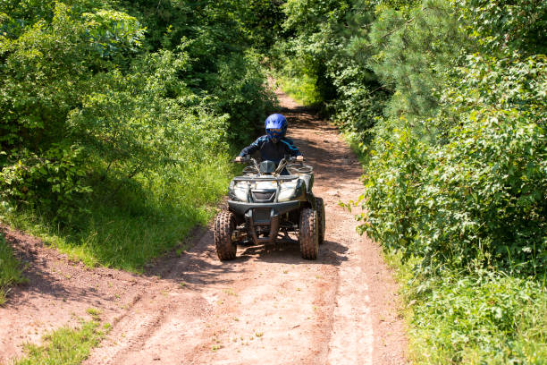 istock A trip on the ATV on the red road. 1311036231