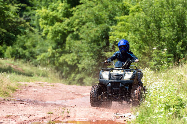 istock A trip on the ATV on the red road. 1311036372