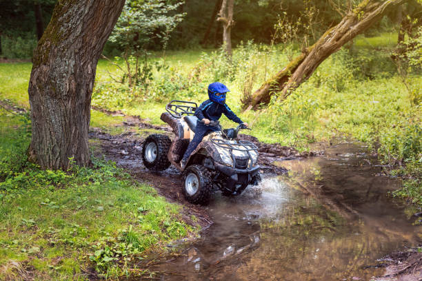 istock A trip on the ATV on the red road. 1311036381