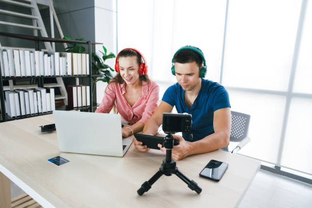 istock Young couple enjoy working on notebook and on mobile smartphone 1311037629