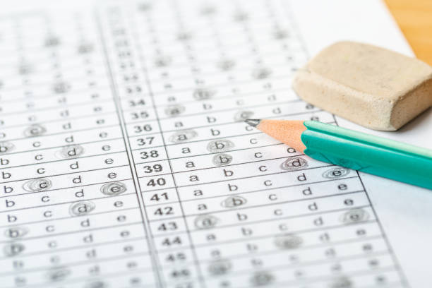 istock testing in exercise and exam paper. computer sheet with pencil in school test room, education concept. filling in answers in pencil 1311039725