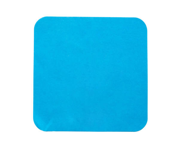 istock Blank blue square adhesive paper sticker label isolated on white background 1311040010