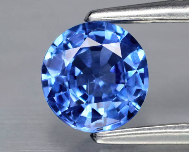 istock Natural gemstone blue sapphire on gray background 1311040695