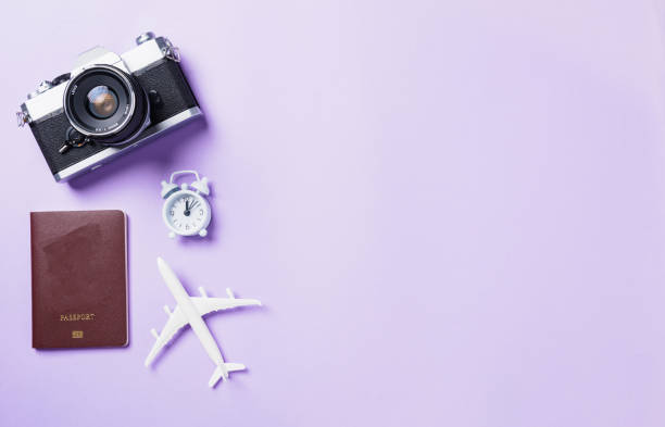 istock retro camera films, airplane, passport travel accessories 1311040931