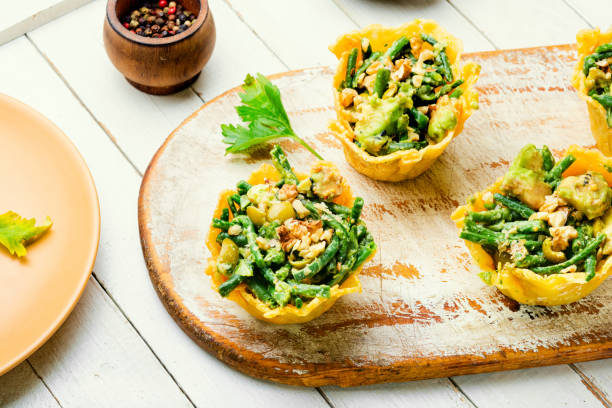 istock Cheese basket filled with vegetables and nuts 1311041075