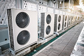 Cooling Air Condition Unit and Control System, Air Condenser Engine Station Outside Building of HVAC Systems. Electrical Compressor Fan Coil of Air Conditioning Equipment for Home Residential Units.