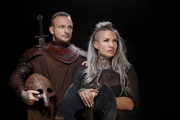 istock Weapon wielding viking warrior couple in studio shot 1311042368