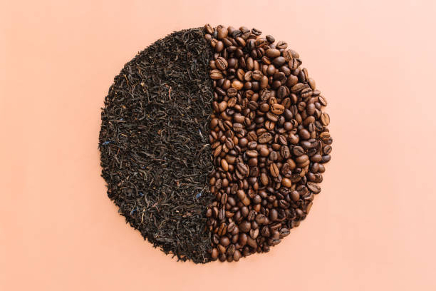 istock Beige flat lay circle with two halves, roasted coffee beans and dried tea leaves 1311042503
