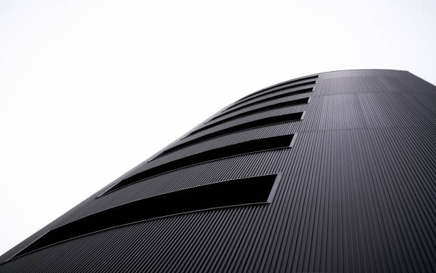 bottom up view of perspective pattern line building with clear white sky background